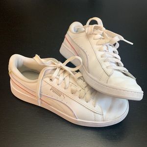 White lace up pumas with pink and purple highlights. Size US women 6.5.